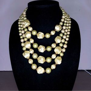 Vintage Japan 4 strands glass and acrylic beads. Light lemony green and cream